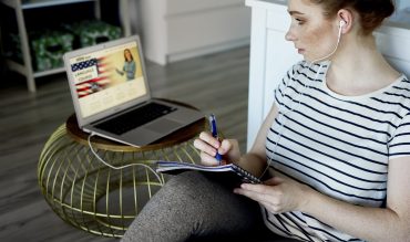 Young woman taking some language lesson online Young woman taking some language lesson online